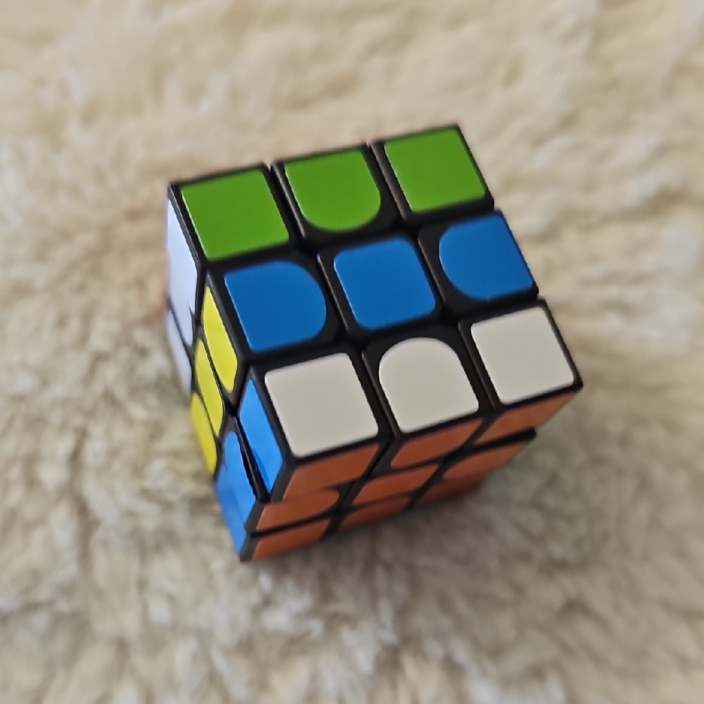 Green and Blue Puzzle Cube Toy